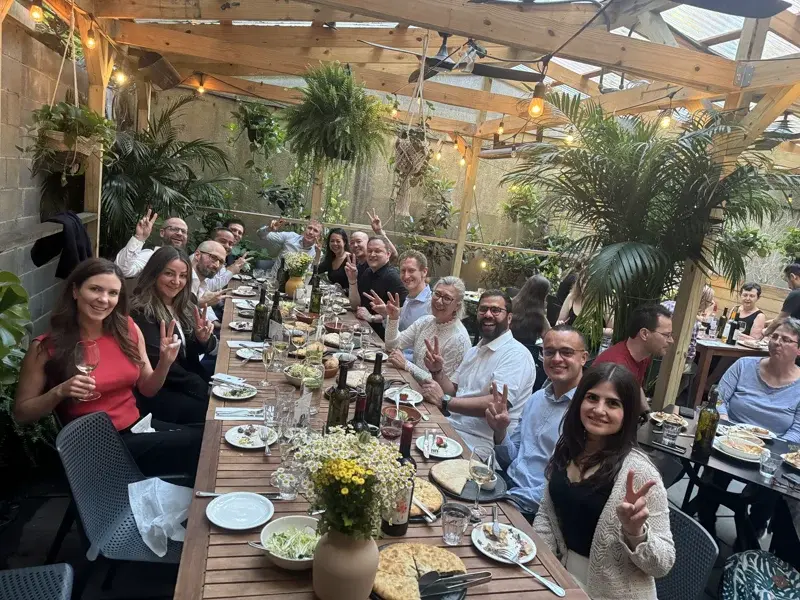 Image of the Cybercube team at a celebration dinner